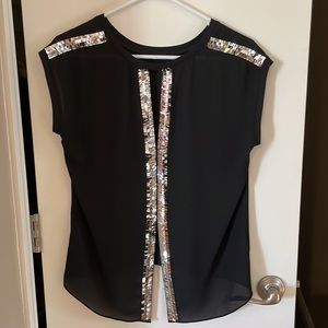 Beautiful slightly sheer black blouse with slit and silver sequin detail on back